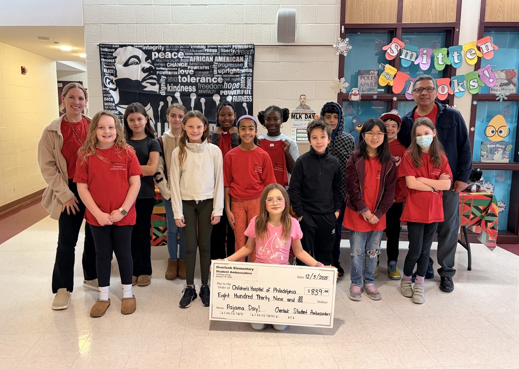 Overlook Student Ambassadors pose with a check to CHOP for $839, raised from Overlook Pajama Day