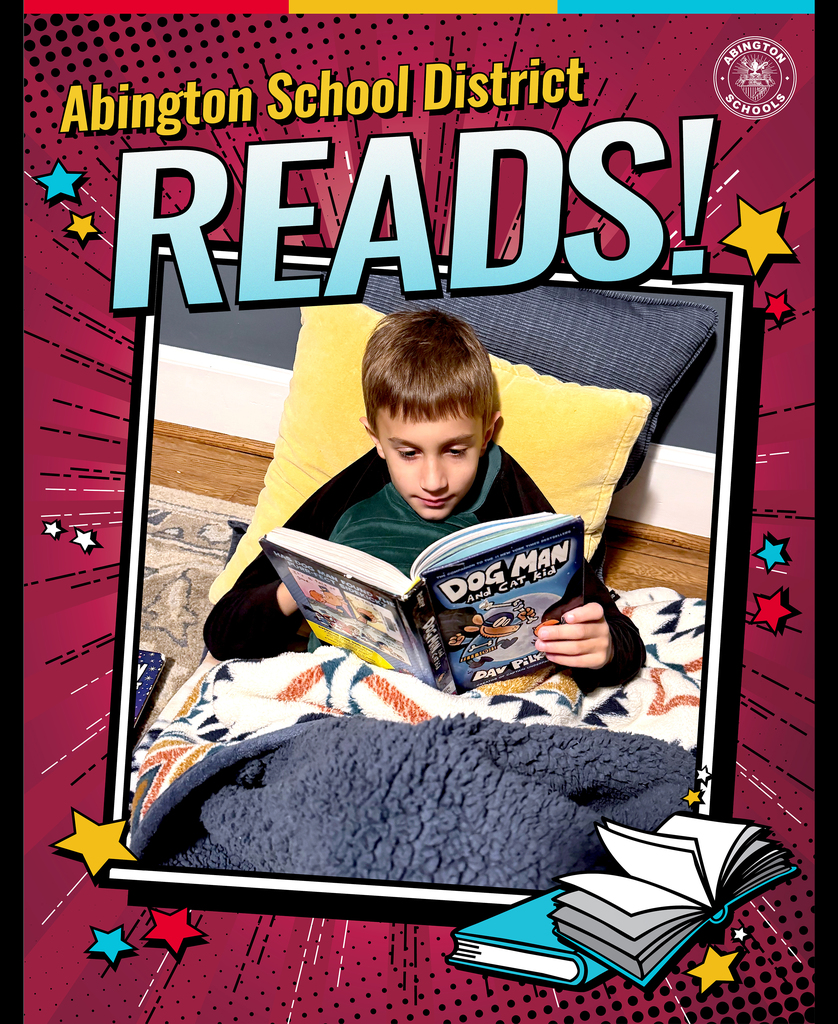 John Dudzinski, Grade 2 at Highland Elementary, reads 'Dog Man and Cat Kid" with pillows and blanket