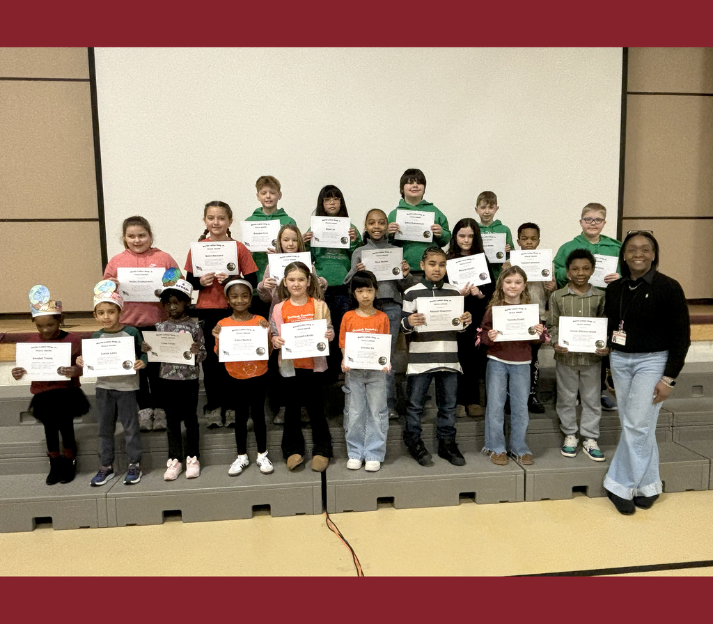Overlook recipients of the MLK Peace Award stand on stage with their certificates