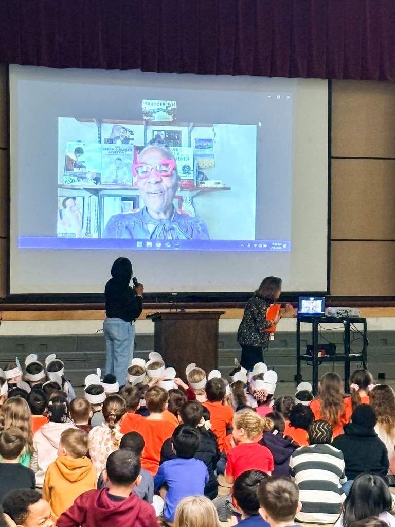 Students and Principal Boyd speak with author Alice Faye Duncan via Zoom during their assembly