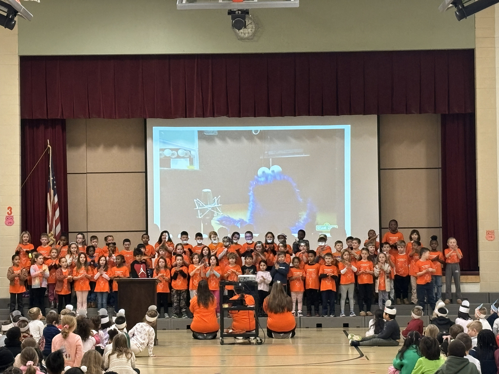 Students perform a song in sign language during the MLK assembly