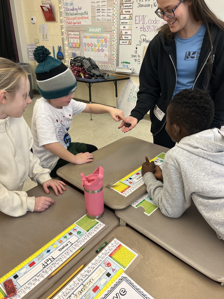 students touching a bug