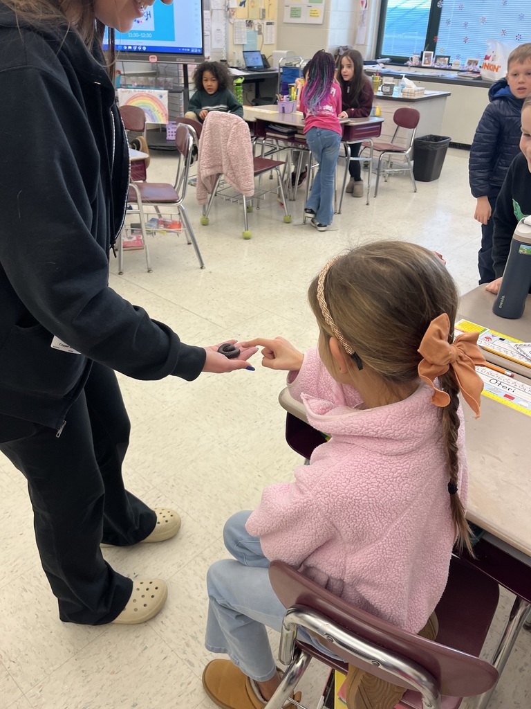 students touching a bug