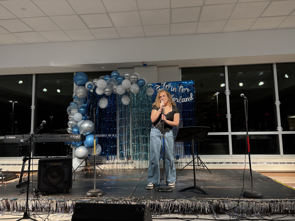 ASHS student  singing solo at Open Mic Night