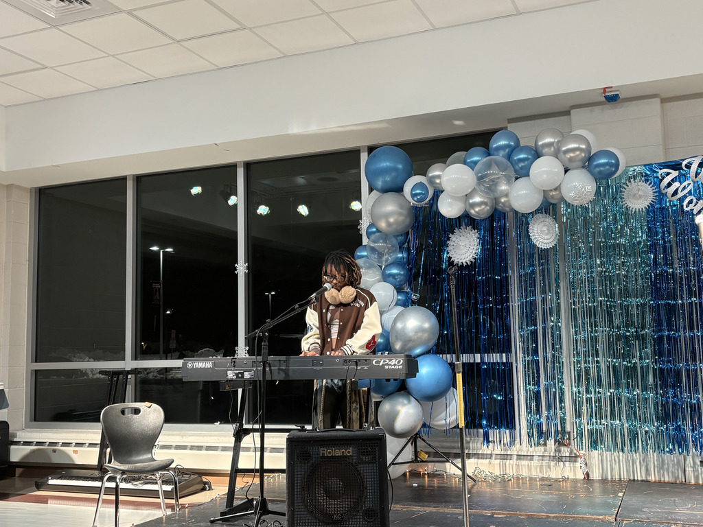 ASHS student playing keyboard at Open Mic Night