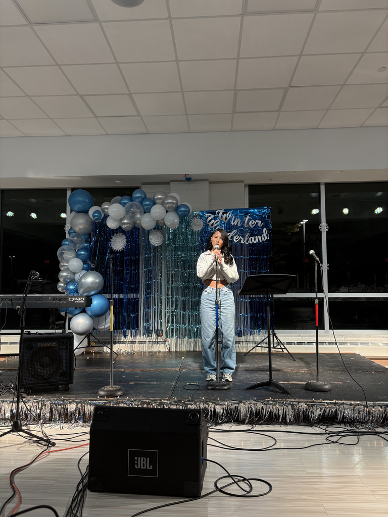 ASHS student  singing solo at Open Mic Night