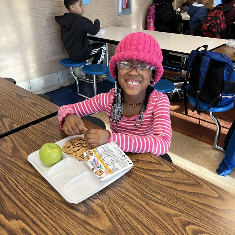 Student at Willow Hill eating breakfast