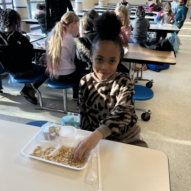 Student at Willow Hill eating breakfast