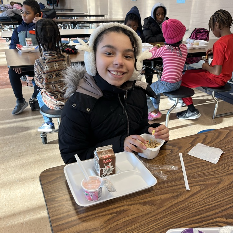 Student at Willow Hill eating breakfast