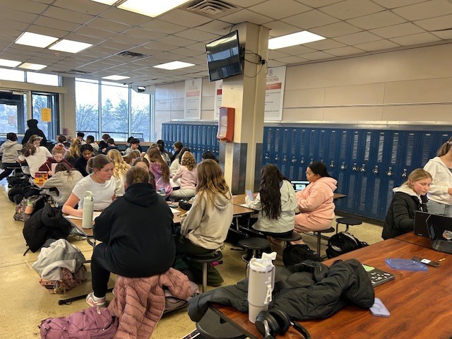 image of Builders Club members getting posters and boxes ready to distribute around AMS last month.
