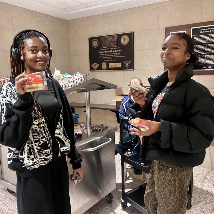 Students pickup their breakfasts at the cart