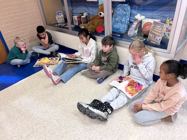 Students form a reading chain across Willow Hill