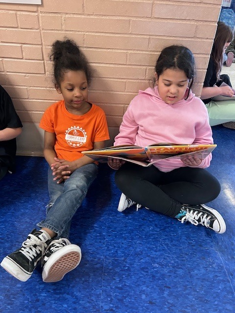 Students form a reading chain across Willow Hill