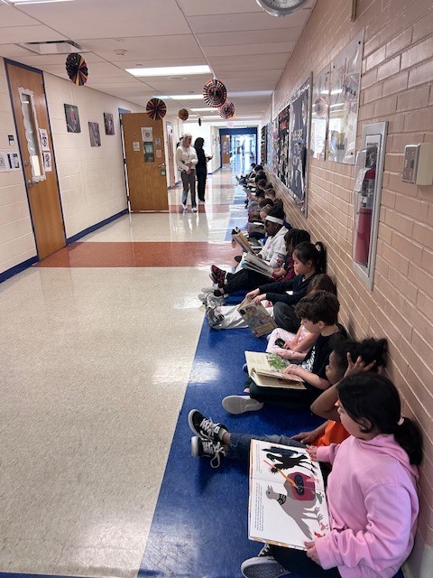 Students form a reading chain across Willow Hill