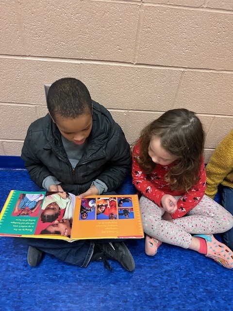 Students form a reading chain across Willow Hill