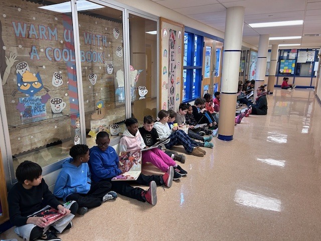 Students form a reading chain across Willow Hill
