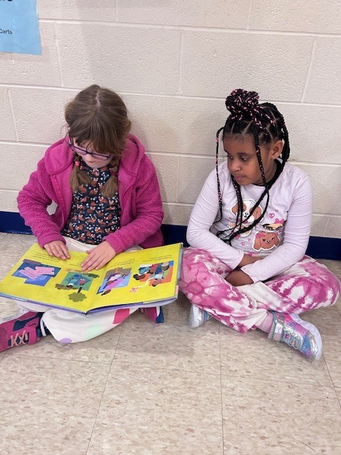 Students form a reading chain across Willow Hill