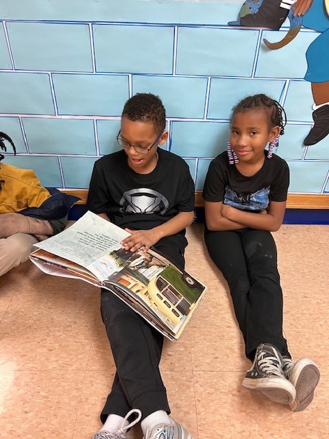 Students form a reading chain across Willow Hill