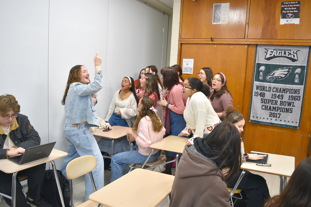 Students singing Valentine grams to fellow students
