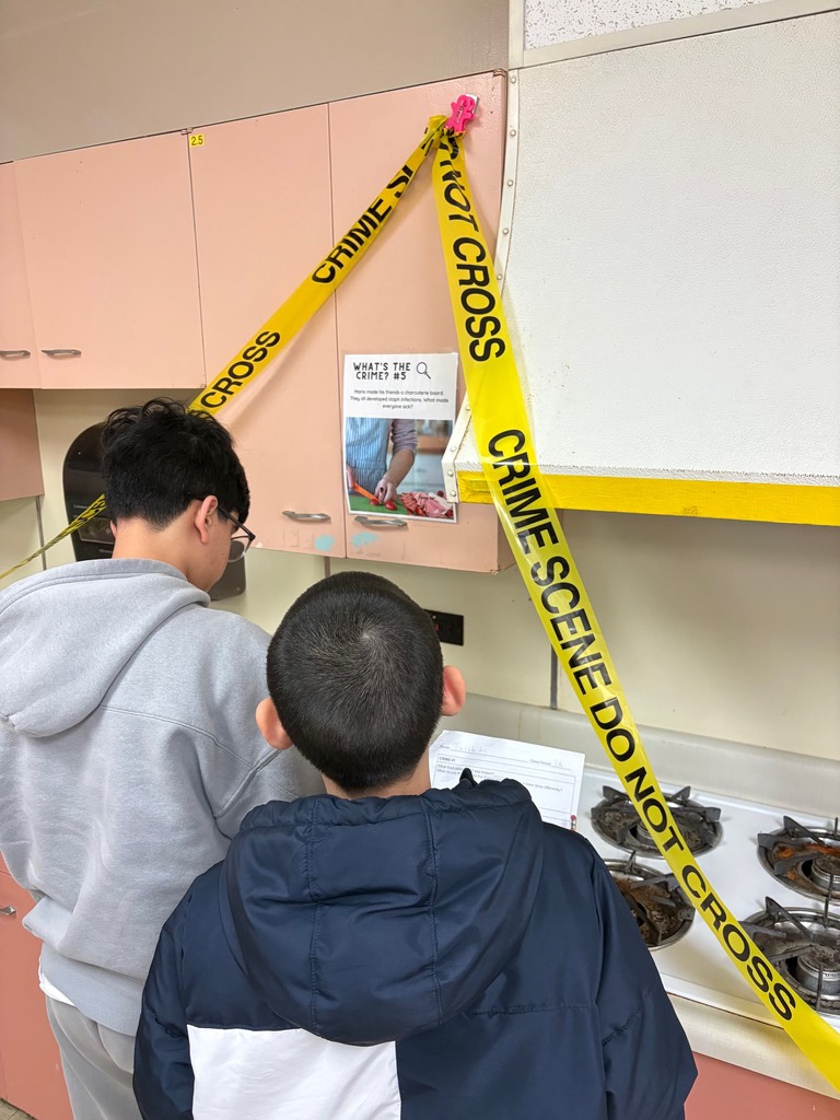Image of 7th grade Personal Development students put on their best detective hats to investigate "Food Crimes"