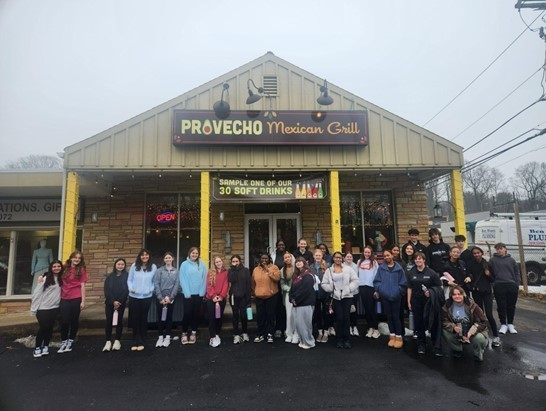 Group of ASHS Spanish 3 students pose in front of Provecho Mexican Grill restaurant