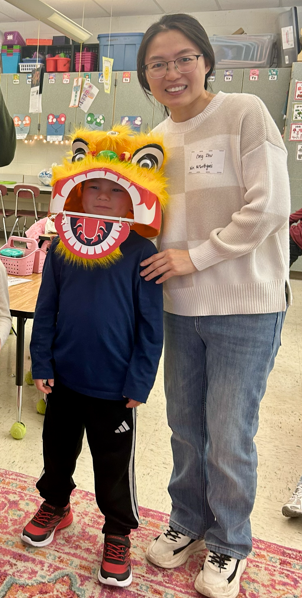 A parent and student smiling for Lunar New Year