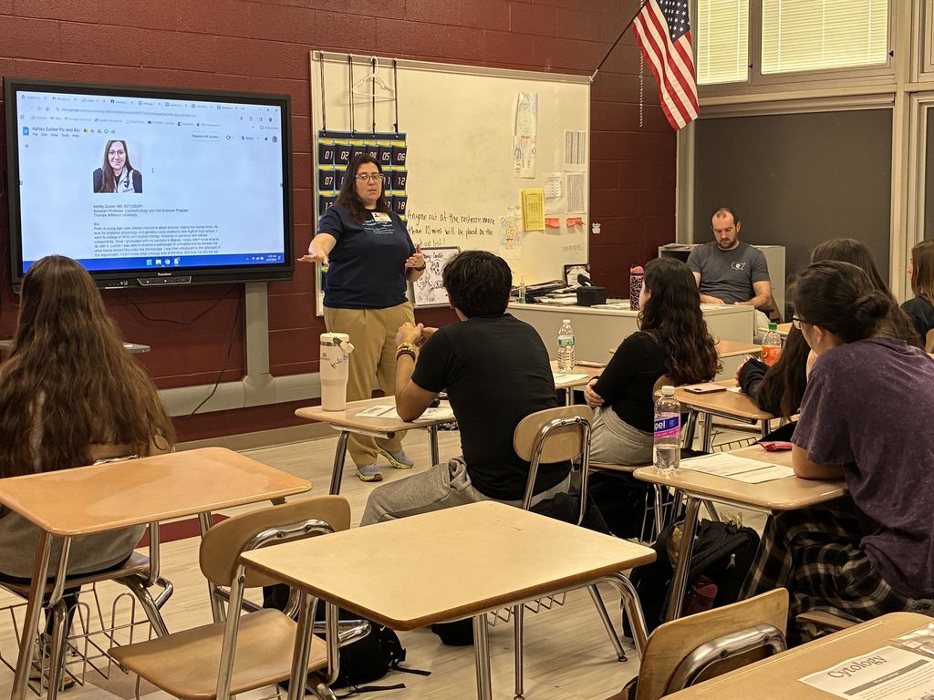 Ashley Zucker talking to students