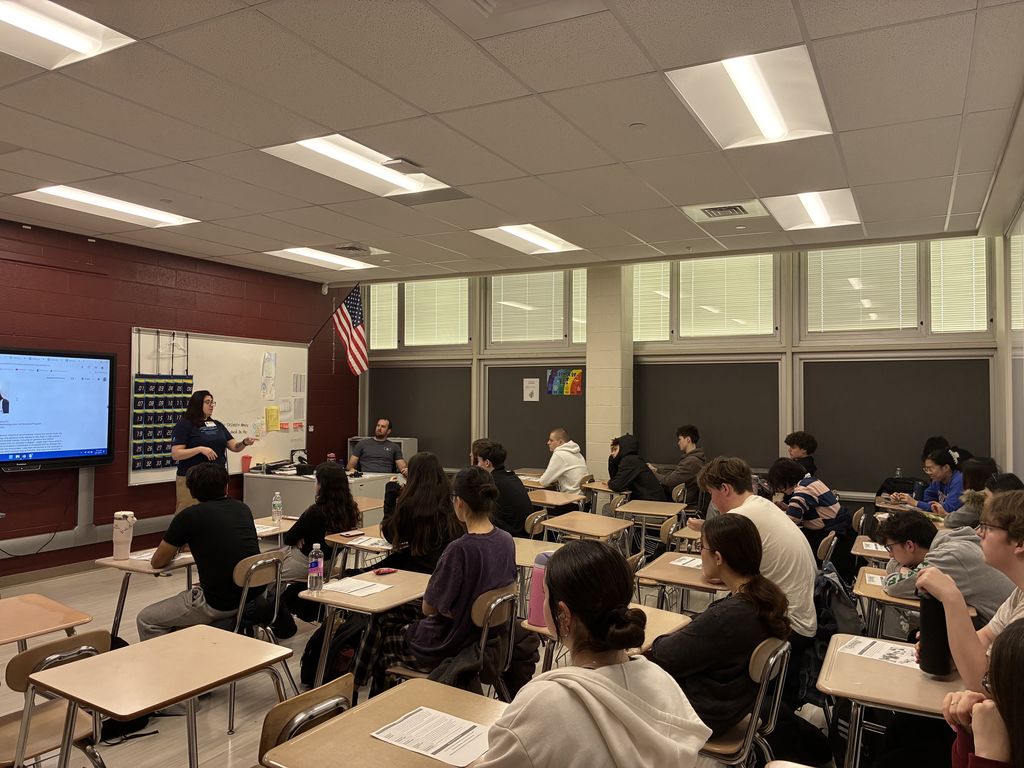 Ashley Zucker talking to students