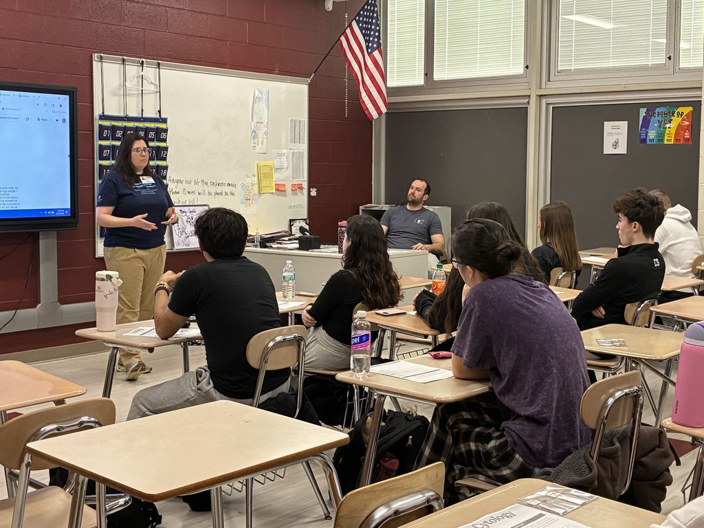 Ashley Zucker talking to students