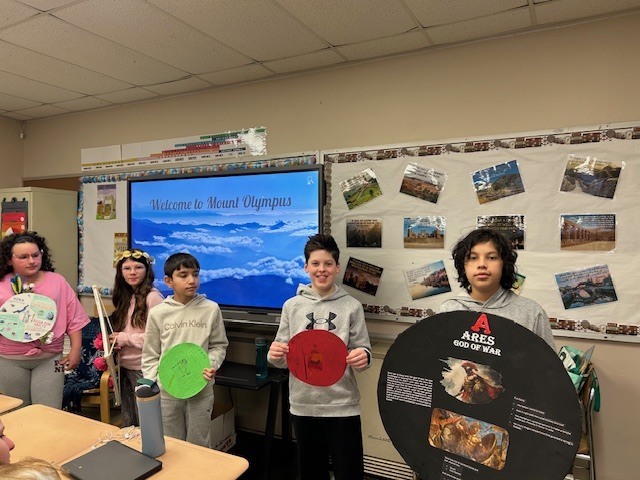 Image of 6th grade students learning about Greek gods and goddesses. 