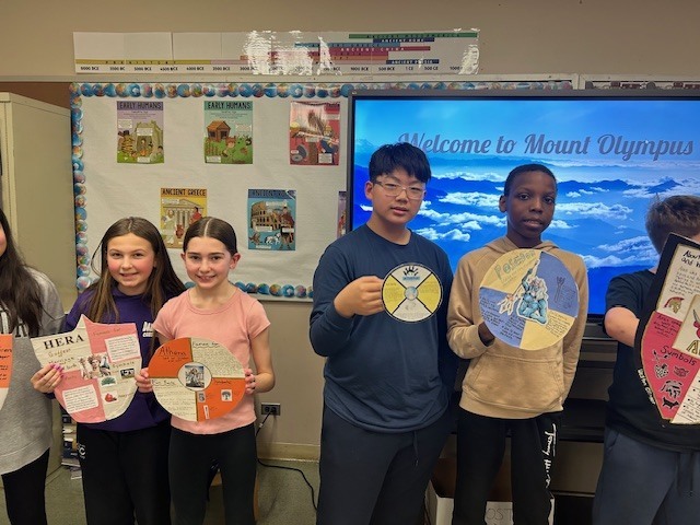 Image of 6th grade students learning about Greek gods and goddesses. 