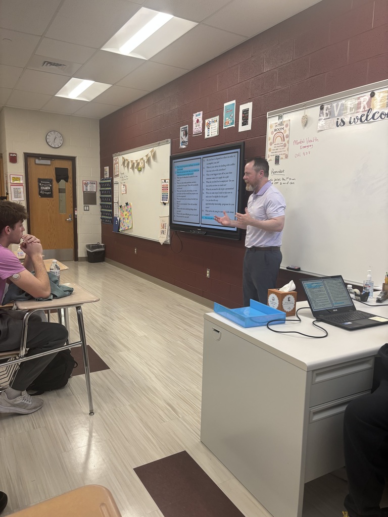 A man talking to students