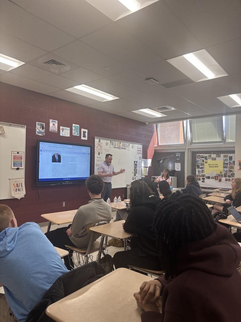 A man talking to students