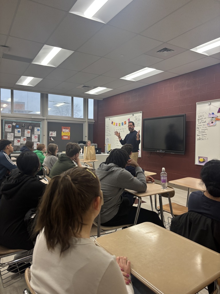 A man talking to students