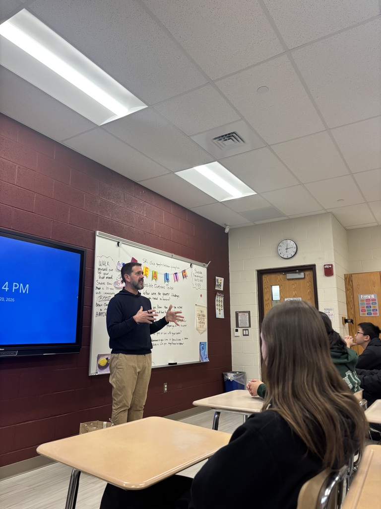 A man talking to students