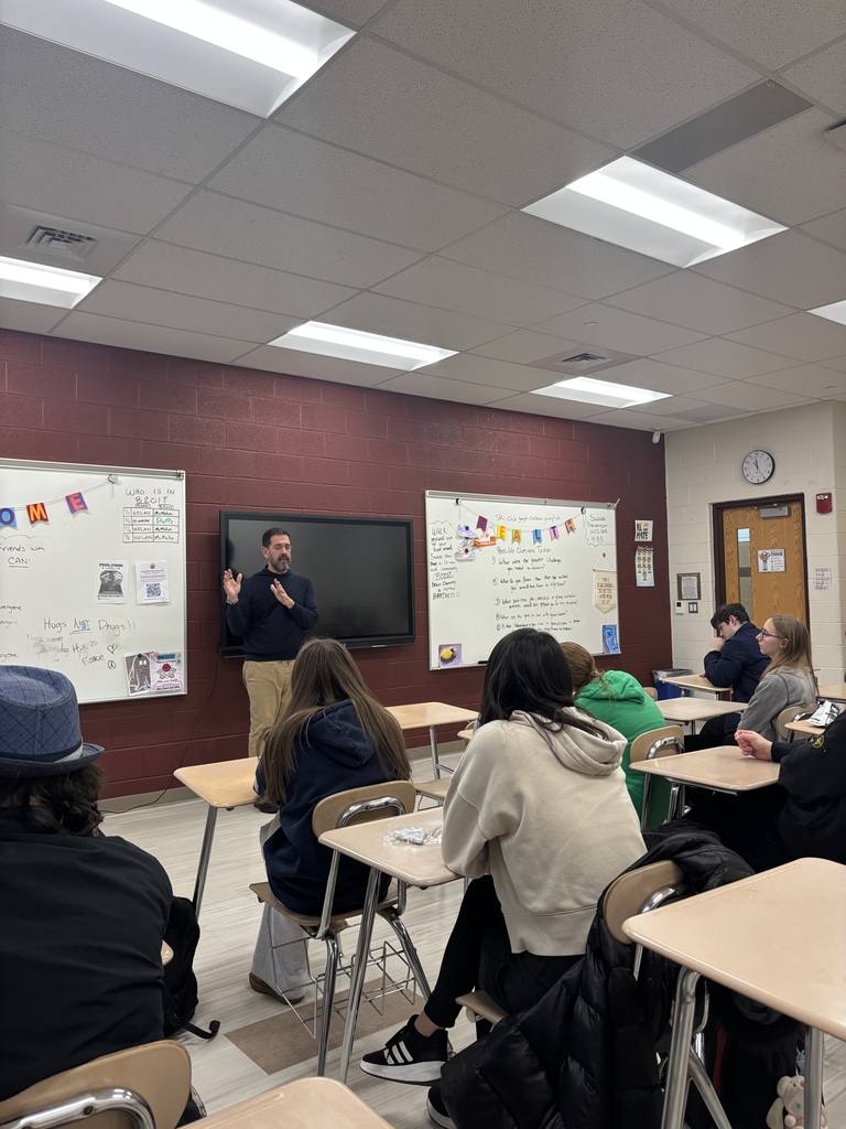 A man talking to students