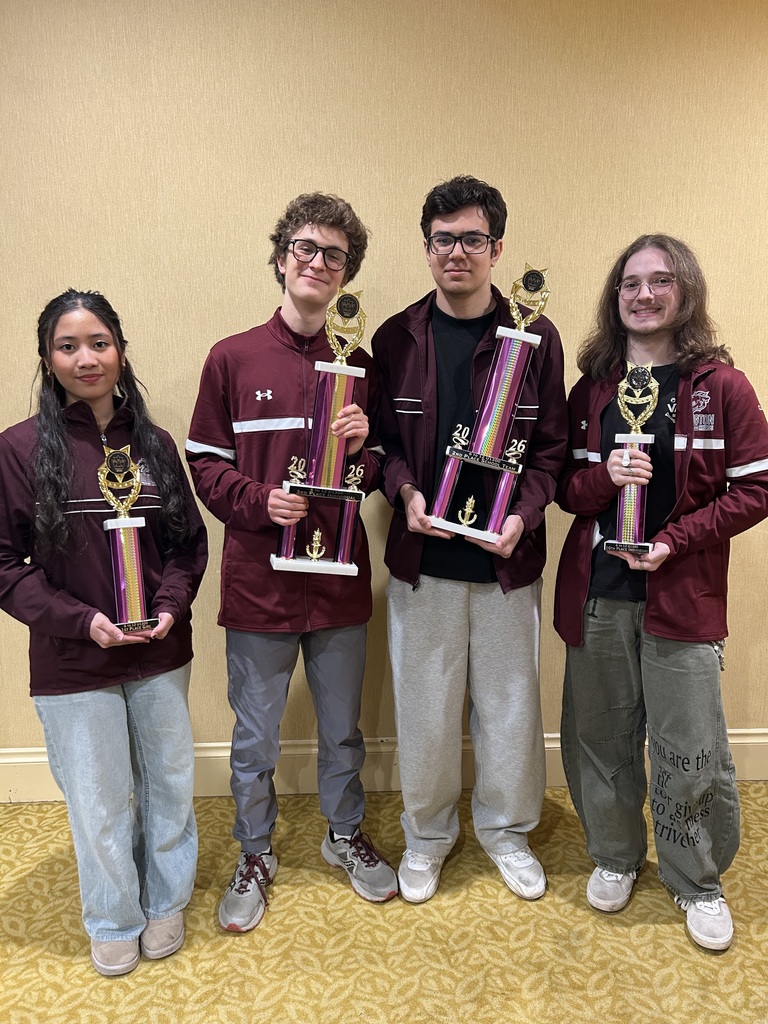 chess team members with awards