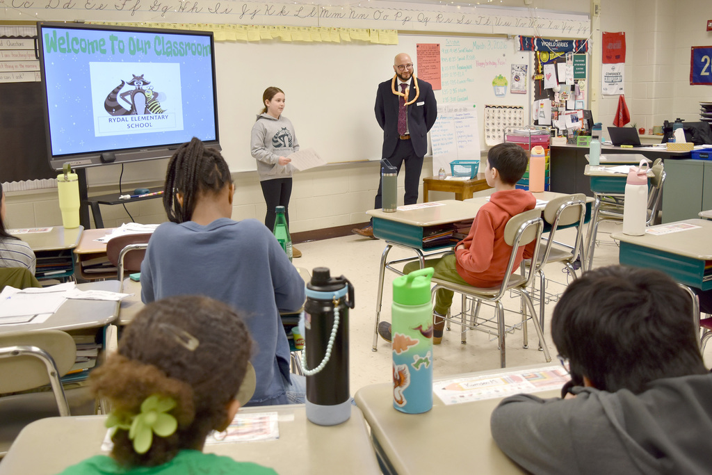 A Rydal 5th grader introduces guest reader Mr. Marcus Delgado, Deputy Secretary for the Office of Administration at the PA Department of Education