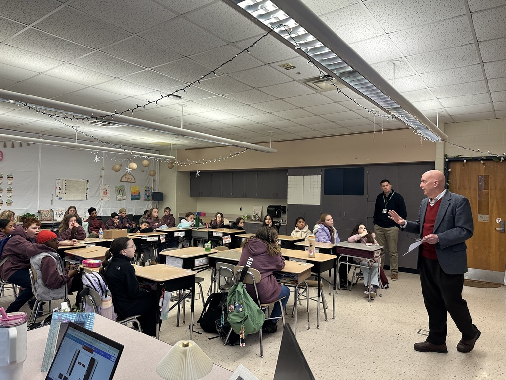 Mr. Jeff Bates meets with student Ambassadors in a McKinley classroom