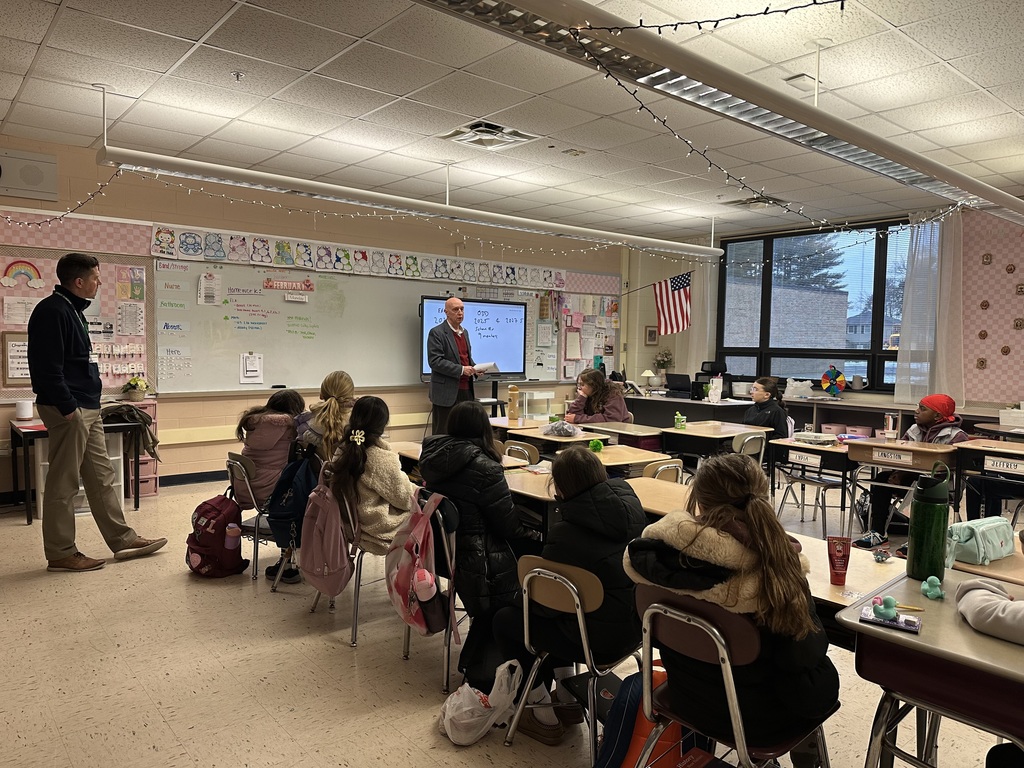 Mr. Jeff Bates meets with student Ambassadors in a McKinley classroom