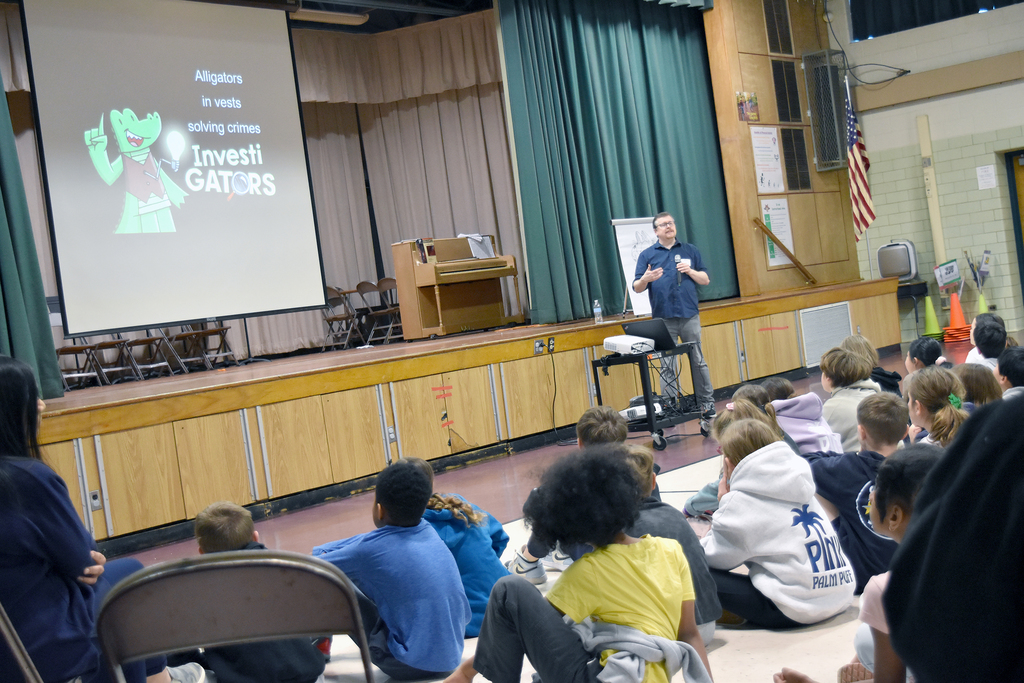 Rydal students sit and listen to author John Patrick Green speak about his InvestiGators graphic novel series
