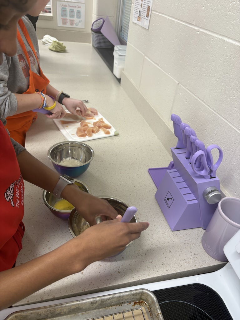 image of students making chicken nuggets
