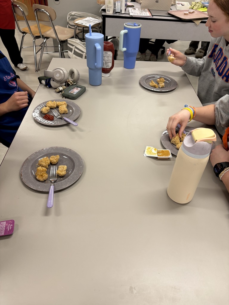 students eating chicken nuggets