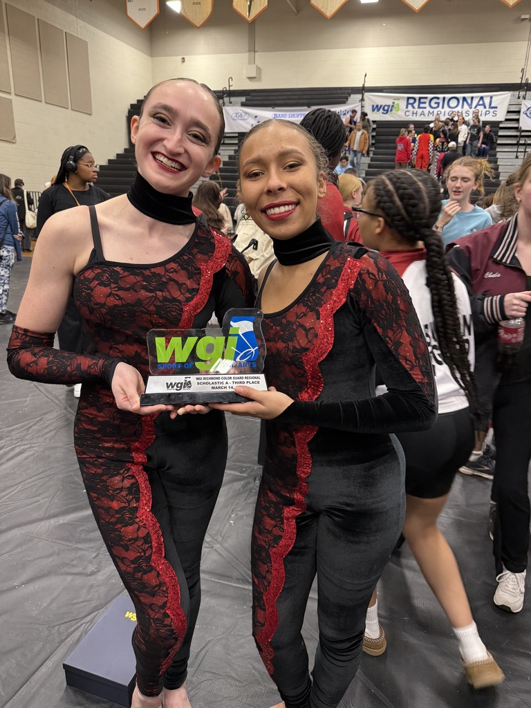 Two of the students with their trophy