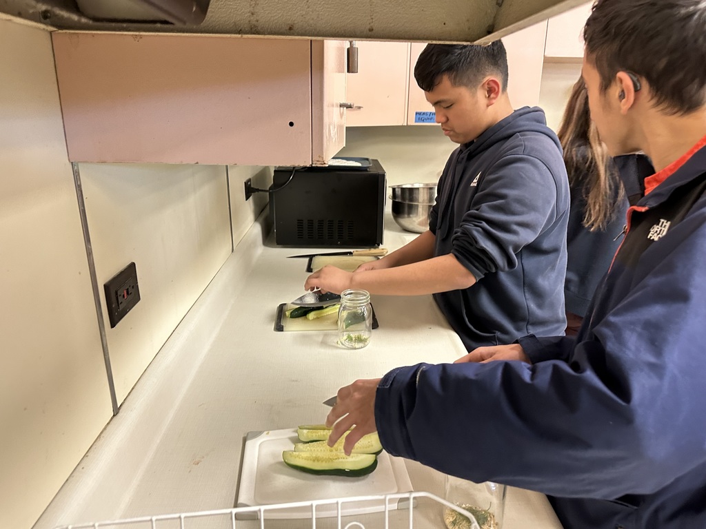 Image of Going Green Club students learning how to make their own pickles at a recent meeting