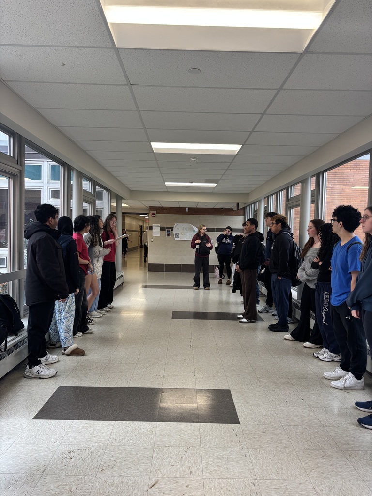 students standing in a hallway 