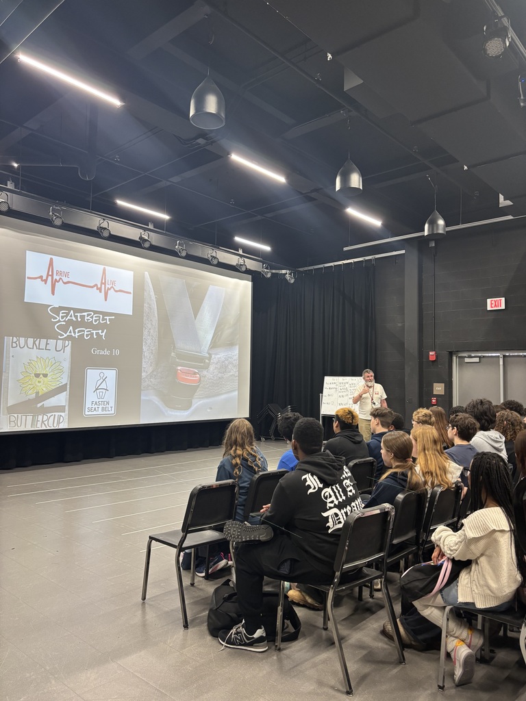 A teacher explains something to students 