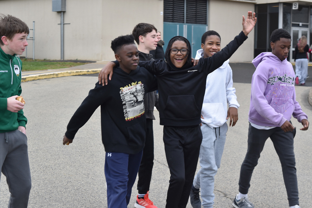 Several students walk together outside during the 9th Annual Buddy Walk.