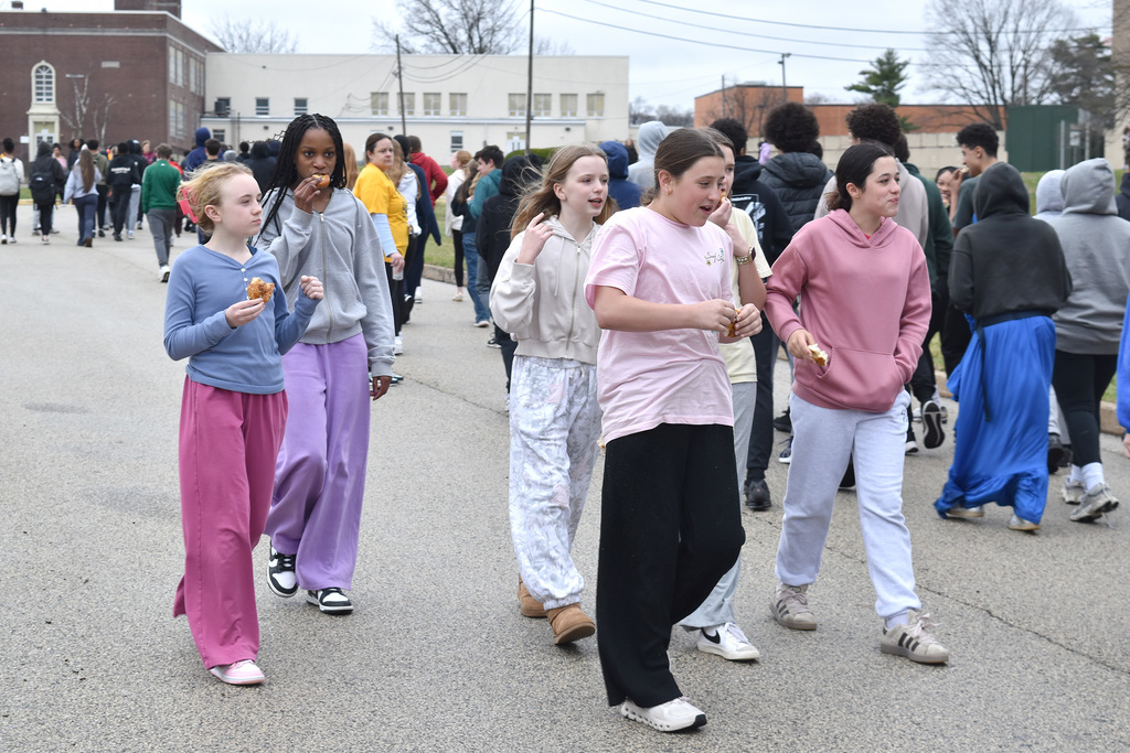 A group of students walk together outside during the 9th Annual Buddy Walk.