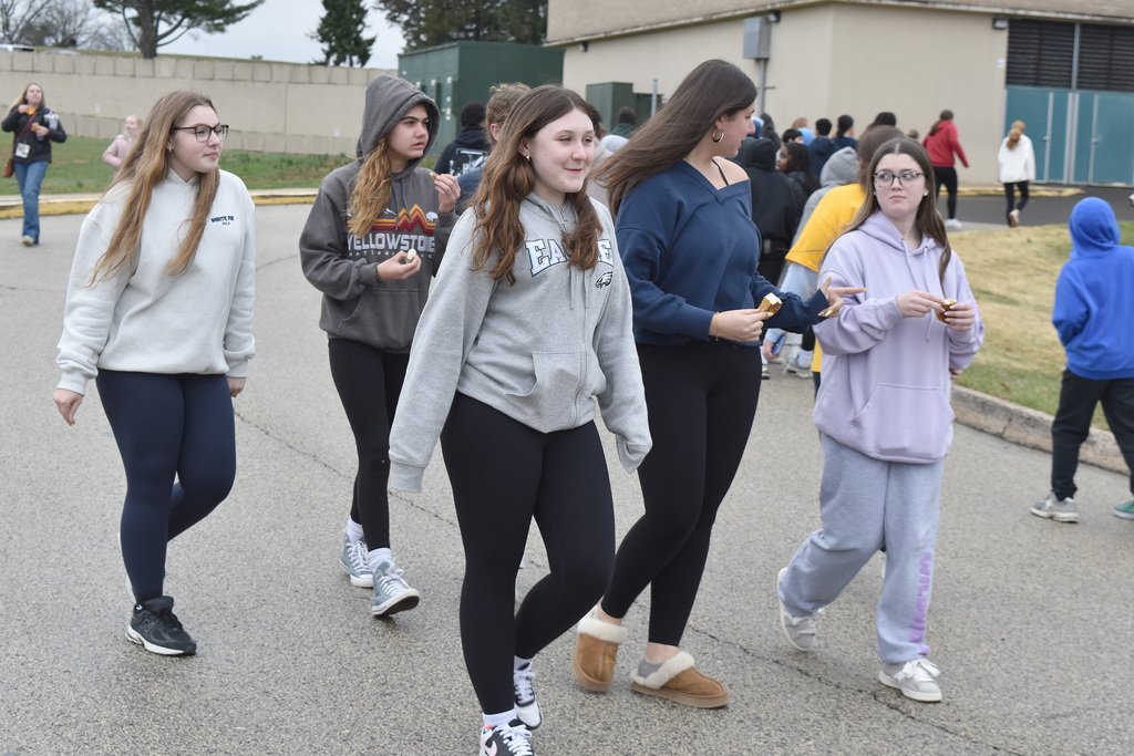 A group of students walk together outside during the 9th Annual Buddy Walk.